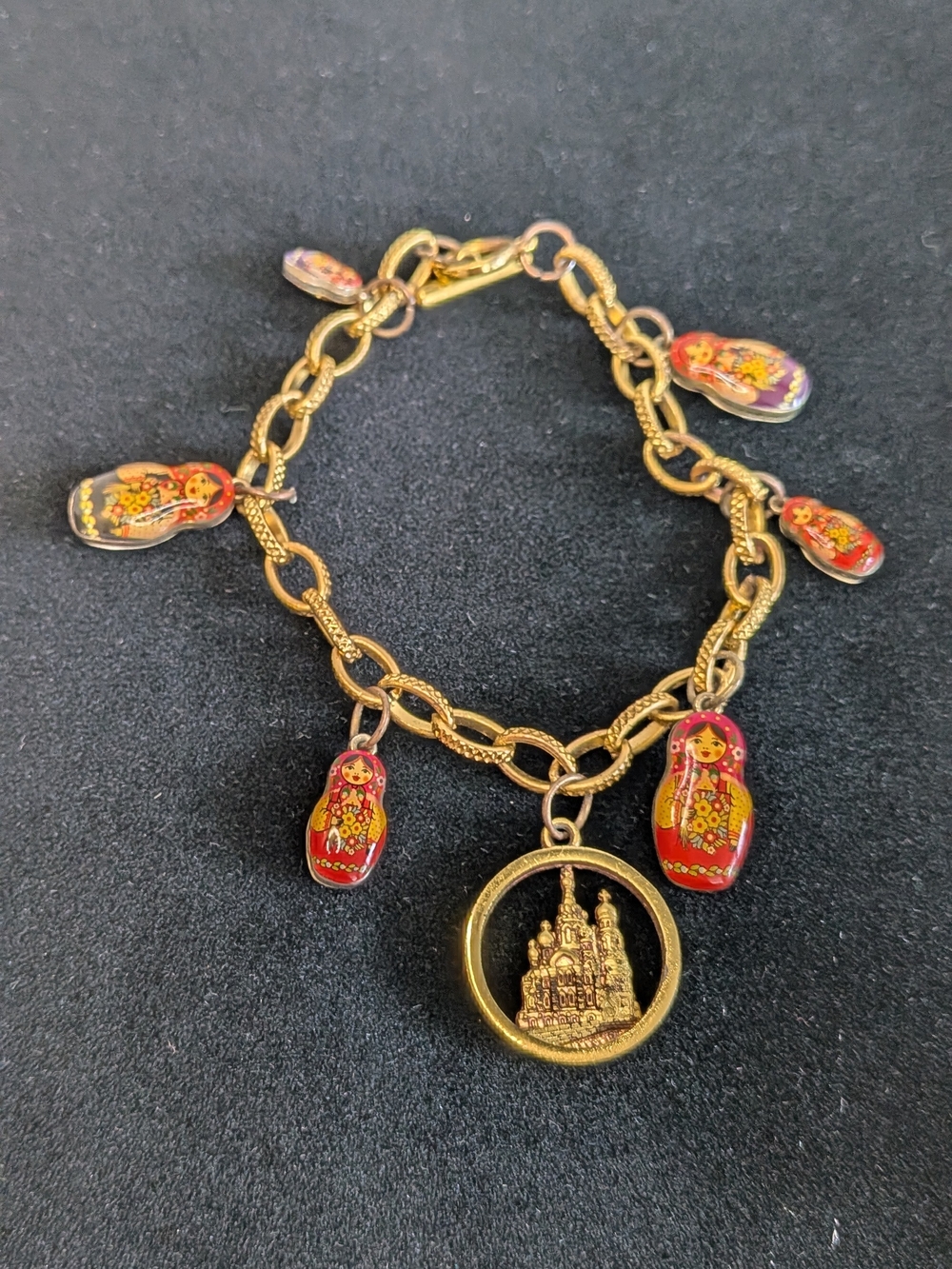 Gold-tone charm bracelet enamel Russian nesting doll matryoshka &  Cathedral